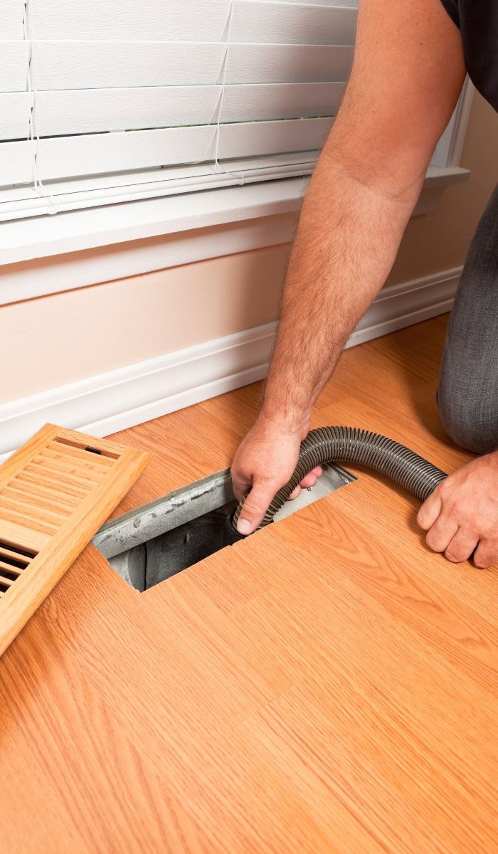What percentage of water and chemical use can be reduced with green cleaning technologies?
